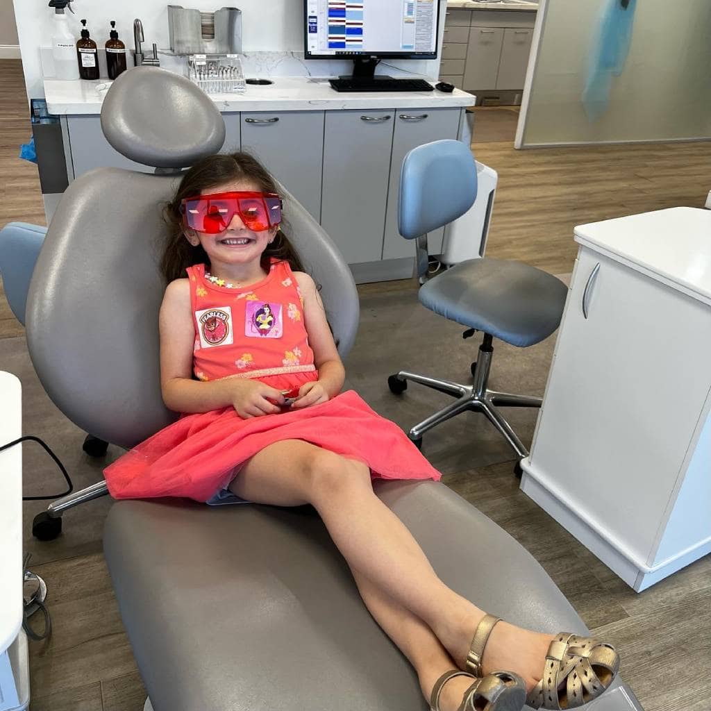 Smiling little girl during treatment